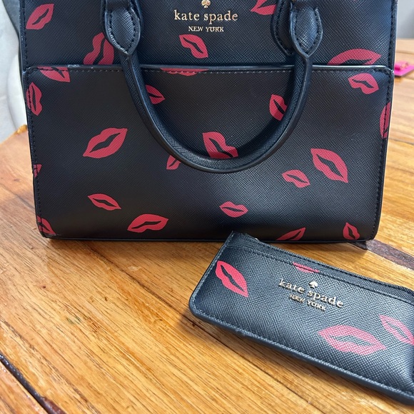 kate spade Handbags - kate spade Black Satchel with Pink Lip Print